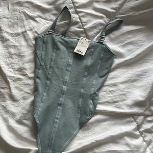 Muted blue bodysuit with buttons